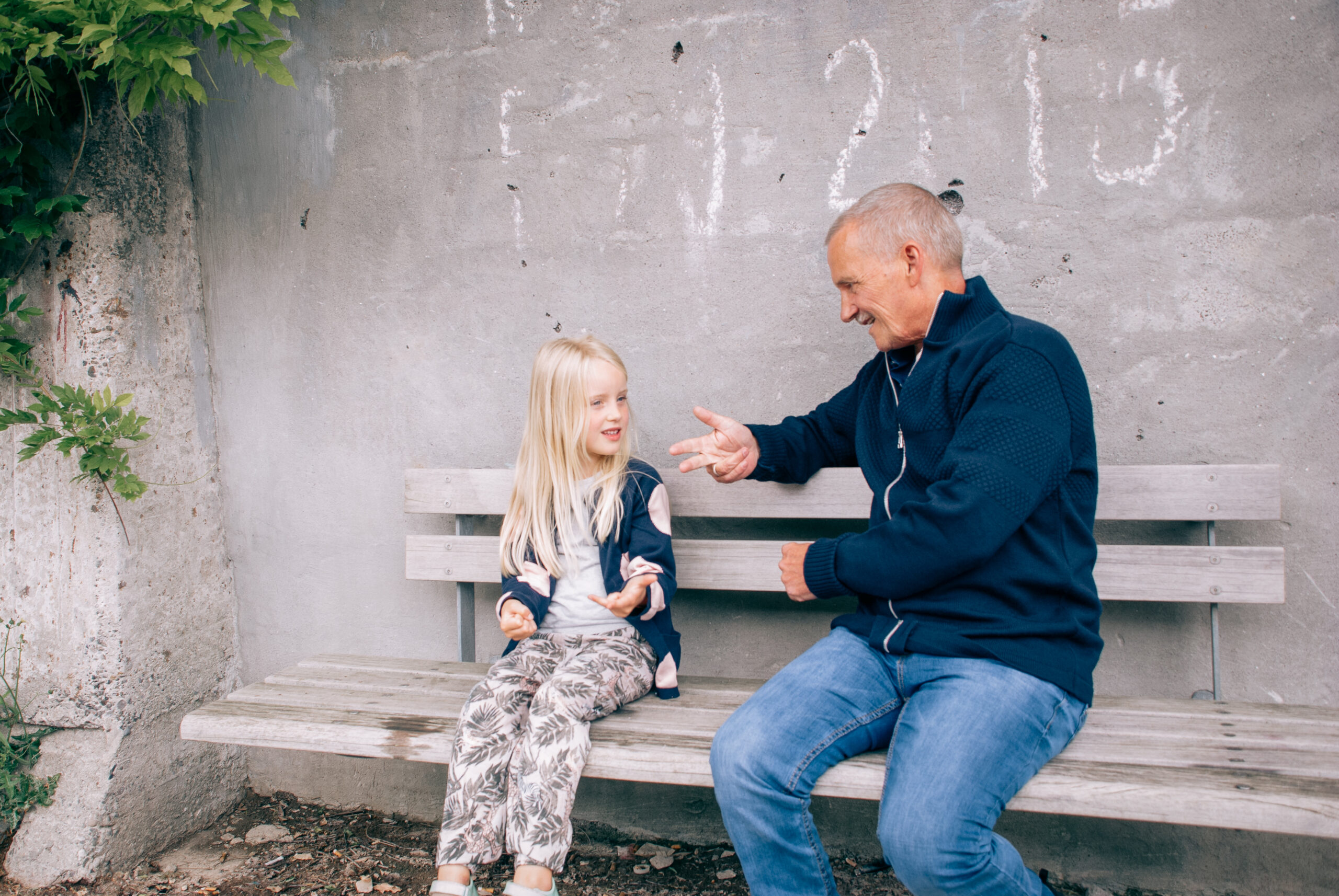 Man talking to grandaughter outside